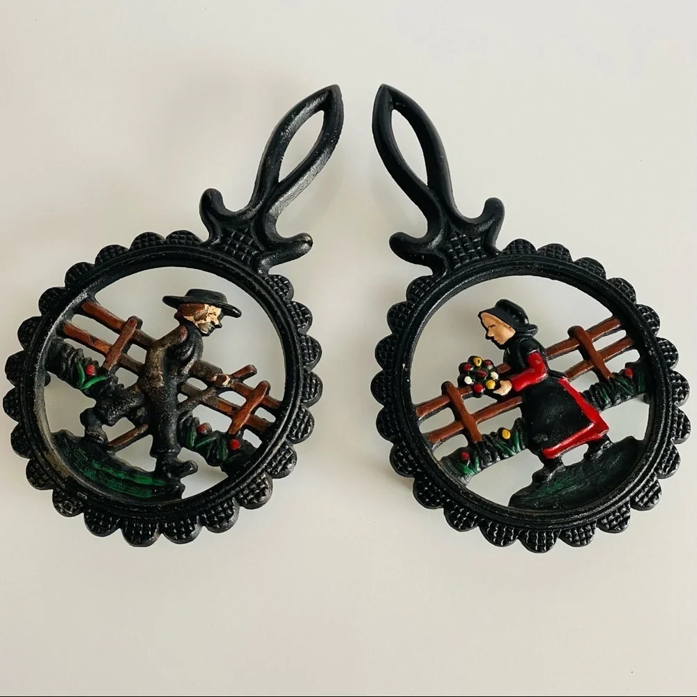 Vintage  Cast Iron Amish Woman and  man Trivets.